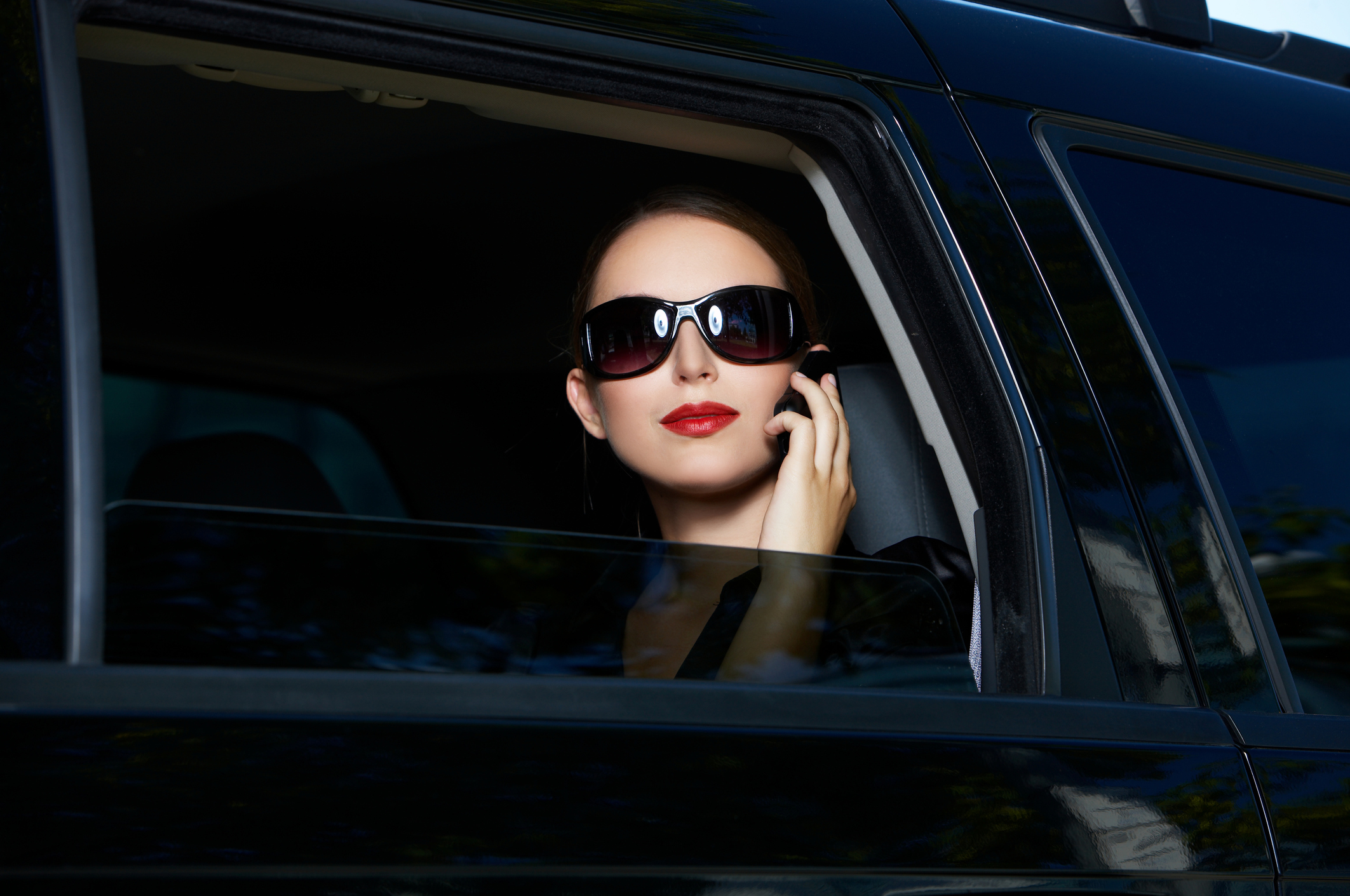 Business traveler riding in a limousine